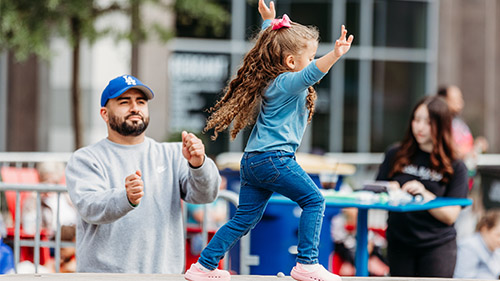 Family playing in Ewell Plaza